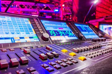 Professional audio sound mixer with buttons and sliders . Selective focus . A little of DOF.