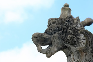 Elaborate dragon head stone in the park