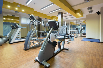 Fototapeta na wymiar Hotel gym interior with equipment