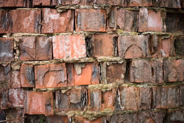 Closeup of grungy red brick wall.