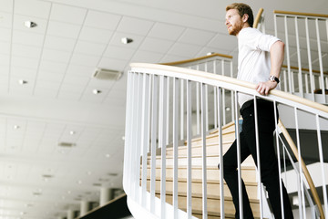 Business visionary represented by a man climing stairs