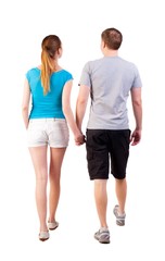  Back view of going young couple