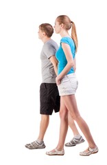  Back view of going young couple