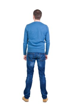 Back view of handsome man in blue pullover.