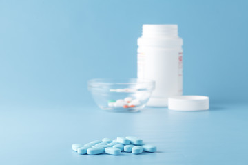 blue and white medicine tablets antibiotic pills.