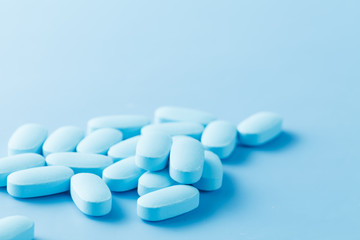 pile of little oval blue pills