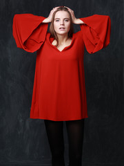 crying woman in res dress, dramatic pose, hands on the head