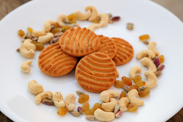 cookies on plate with dry fruits