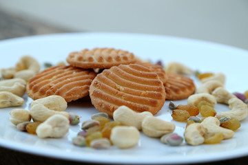 cookies on plate with dry fruits