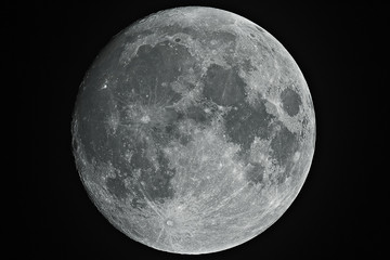 Growing big moon taken with telescope in black background. - obrazy, fototapety, plakaty
