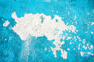 Close-up of cracked blue cement wall