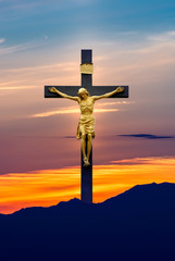 Jesus Christ on the cross over sky background