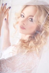 photo of a beautiful blonde bride in a luxurious wedding dress in elegant expensive interior