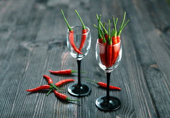 Red pepper on old wooden table.