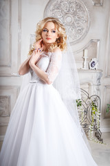 Obraz premium photo of a beautiful blonde bride in a luxurious wedding dress in elegant expensive interior
