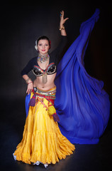 Beautiful exotic belly tribal dancer with blue shawl woman