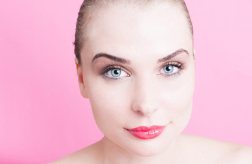 Fototapeta premium Beautiful face female model on pink background