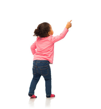 African Baby Girl Pointing Finger To Something