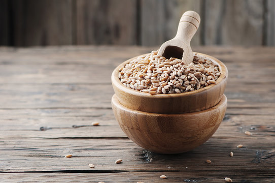 Raw Pearl Barley On The Wooden Table