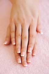 Woman hands with beautiful french manicure