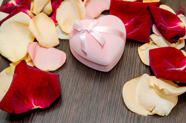 petal rose with gift box on table. valentine concept background