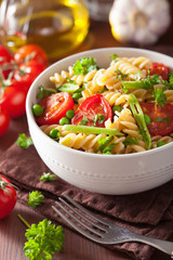 vegetarian pasta fusilli with tomato peas herbs