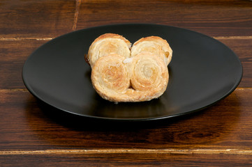 Puff pastry over wooden table