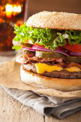 bacon cheese burger with pickles tomato onion
