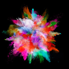 Explosion of colored powder on black background