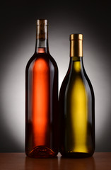 Fototapeta na wymiar Two Wine Bottles Backlit