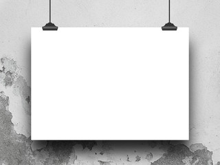 Close-up of one hanged poster paper sheet with clips on weathered concrete wall background
