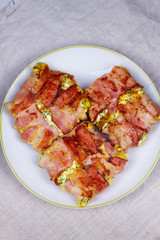 Bacon wrapped cheese. View from above, top studio shot