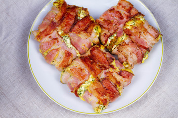 Bacon wrapped cheese. View from above, top studio shot
