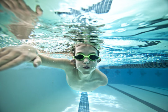 kid swimming laps, view from underwater