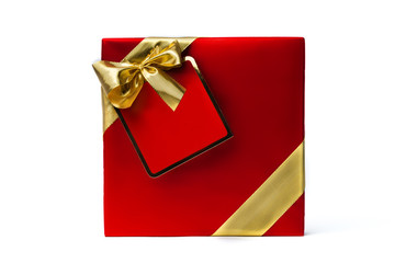 Gift box with a gold ribbon bow, isolated on white background