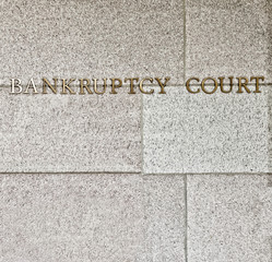bankruptcy court sign in square format on granite