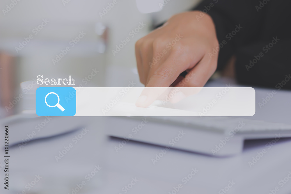 Poster search bar on a virtual screen with his finger activating a global online computer search for a webs
