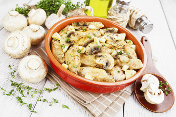 Chicken wings baked with mushrooms