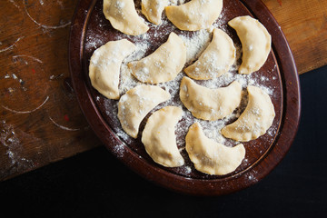 Vareniki with cabbage ( dumplings ) , pierogi before boiling - t