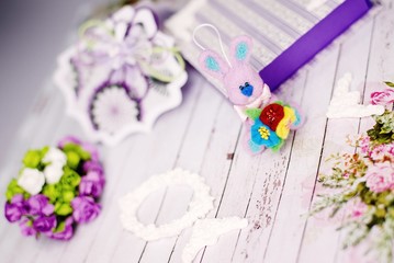Handmade gift box, rabbit and decorations on wooden table background