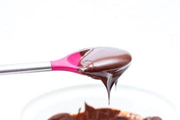 chocolate mix in a pink spoon 