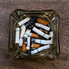 Scrap cigarette butt in an ashtray.