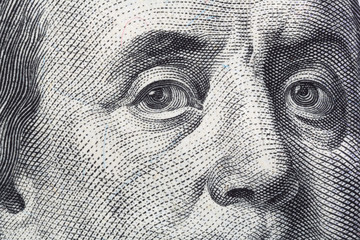 Close view of Benjamin Franklin on the front of a US hundred dollar bill. - obrazy, fototapety, plakaty