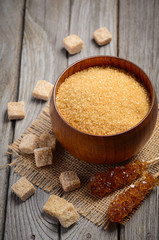 Brown sugar variety on rustic background. Selective focus.