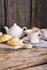 Kitchen simple still life of tea, cup, white sugar lump in a bank and fresh homemade cakes