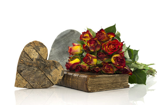 old book with red and yellow roses