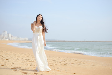 Fototapeta na wymiar Beautiful sexy elegant female on the beach background