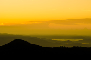 art tone,blurry,silhouette of sunset in the mountain