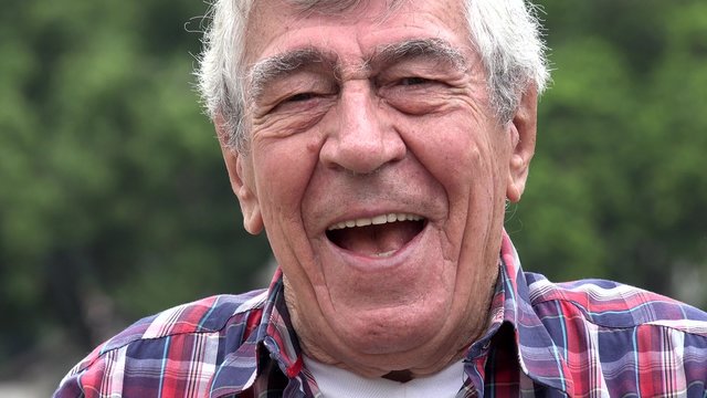 Excited And Laughing Older Man