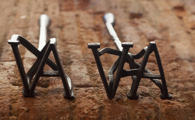 Two rustic branding irons for cattle